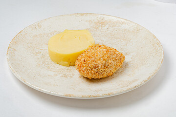 A delicious serving of crispy breaded chicken paired with smooth, creamy mashed potatoes