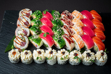 A stunning sushi platter features colorful rolls, ideal for sharing