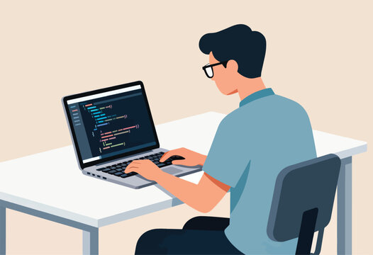 A person with glasses types code on a laptop, at a desk. The code is shown on the screen