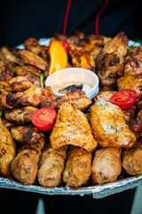 Enjoy grilled chicken wings and fresh veggies at a fun outdoor event!