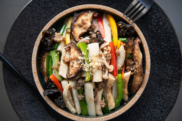 Colorful Stir-fried Vegetables with Mushrooms and Peppers in a Bowl