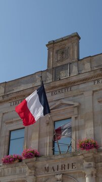 French Flag Waving on Historic Town Hall in Dunkirk