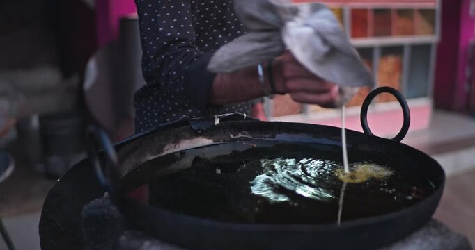 Traditional Indian Jalebi Making &ndash; Batter Pouring, Frying, and Dipping in Sugar Syrup