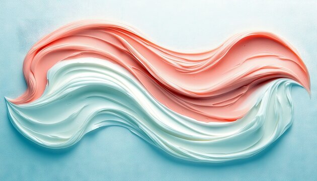 A close-up abstract shot of swirling pink and white cream or paint, creating a wave-like pattern against a soft blue backdrop.