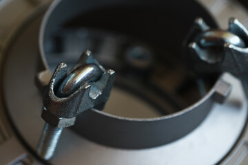 Close-Up of Industrial Metal Clamp with Bolts for Mechanical and Engineering Applications