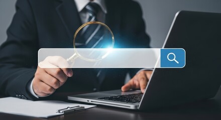 Businessman using magnifying glass and laptop for data analysis and search optimization