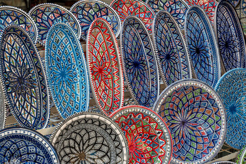 Background with Tunisian traditional ceramic in the plates form, painted with specific patterns.