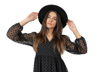 Young woman wearing black polka dot dress and hat, posing with hands near head isolated isolated on transparent background