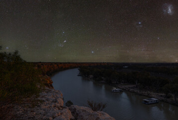 Golden afternoon light illuminates the dramatic limestone cliffs of Big Bend along the River Murray near Swan Reach, South Australia.