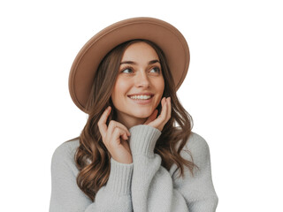 Young woman with hat and sweater smiling with hands on face, looking up. isolated on transparent background