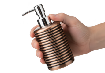 Hand holding a decorative bronze ribbed soap dispenser with a metal pump mechanism isolated on transparent background