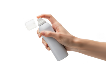 Hand holding aerosol spray can with cap off, ready to dispense product isolated on transparent background