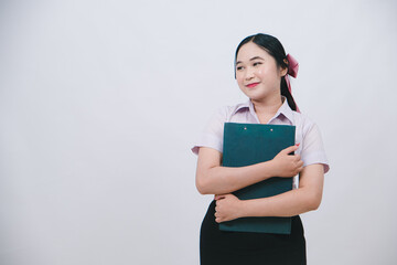 Young woman in professional attire smiling and holding a clipboard against a white background, portraying confidence and readiness for work or study