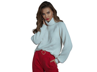 Woman in white turtleneck sweater and red pants posing confidently, studio portrait isolated on transparent background