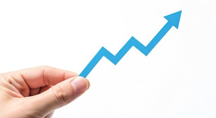Hand holding a bright blue upward trending graph arrow symbolizing growth and success isolated on white background