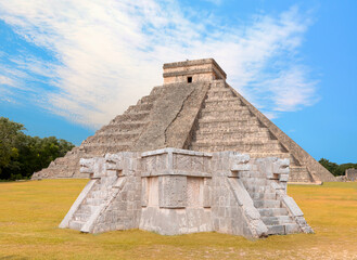 Four large snake heads carved from stone at the ancient Mayan ruins at Chichen Itza - The pyramid of Kukulcan in the Mexican city of Chichen Itza - Yucatan, Mexico