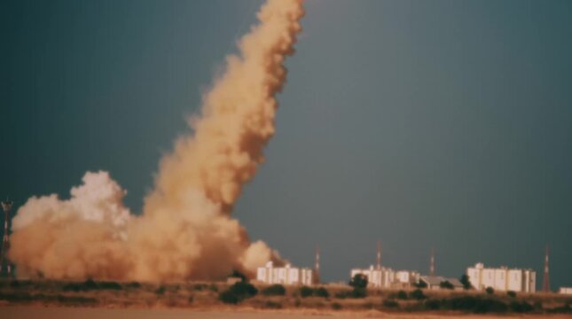 Grainy footage of dusty trace left by a rocket at launch