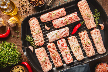 Tarb is a Middle Eastern dish that combines minced meat, onions and various spices. It wrapped in a layer of lamb fat and ready for grilling.