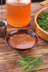 Japanese matcha tea ceremony with green tea powder and traditional ceramic bowl on rustic wood table