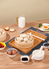 Traditional Steamed Buns Breakfast Spread with Bamboo Steamer and Fresh Ingredients on Wooden Table