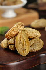Fresh Peanuts in Shells on Wooden Board - Healthy Natural Snack Food Display