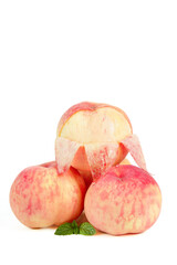 Fresh Summer Peaches Sliced with Mint Leaves on White Background