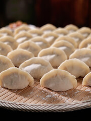 Traditional Handmade Dumplings on Bamboo Steamer - Fresh Asian Cuisine Preparation