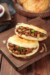 Authentic Shaanxi Roujiamo Chinese Pork Sandwiches Tongguan Style on Wooden Board