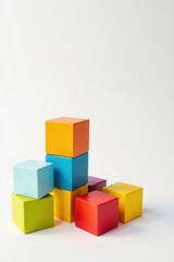 Obraz premium A vibrant arrangement of colorful wooden blocks, meticulously stacked in a dynamic composition, showcasing a playful yet structured design on a neutral background.