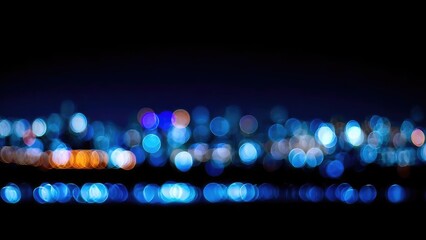 Blue and orange bokeh city lights at night over a dark water horizon. Concept Blue and orange bokeh, Night city lights, Water horizon, Dark water, Night photography