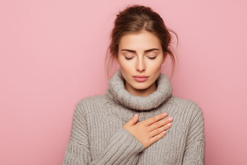 Serene beauty embraces tranquility, hand over heart, in a cozy moment of self-care and mindful peace against a soft pink backdrop for wellness campaigns