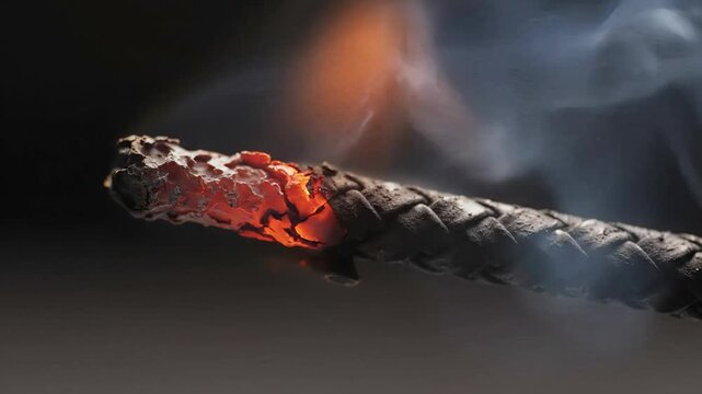 Fuse wire sparking illustrates electrical ignition, with a glowing ember traveling along wire's thread. Fuse wire combustion shows ignition of potentially hazardous material under intense conditions.