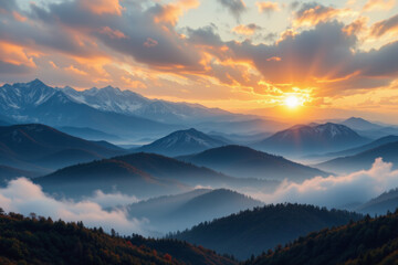 Obraz premium Sunset over misty mountain range with colorful clouds and layered hills creating peaceful and immersive natural landscape