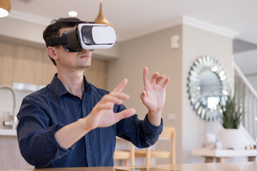 man using virtual reality headset indoors, interacting with invisible interface. Concept of immersive technology, VR innovation, digital experience futuristic user interaction.