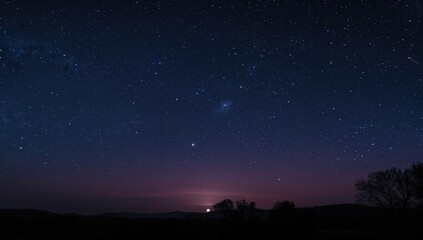 Fototapeta premium Stars twinkling in the night sky, a serene backdrop for contemplation