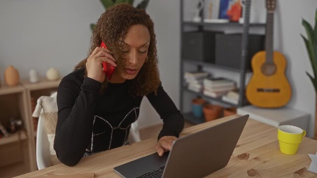 Woman holds red smartphone to ear inside building; professional productivity concentration efficiency.