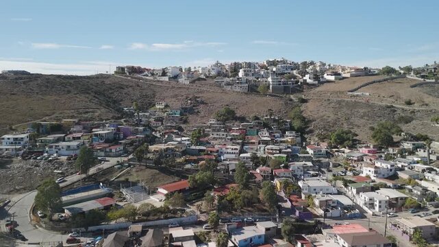 Houses and Buildings by the Mountains Cliff Skyline in Ensenada Mexico Drone Footage
