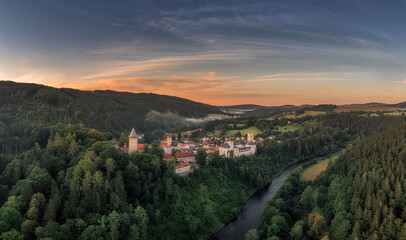 sunrise over Rozmberk Castle above the Vltava River