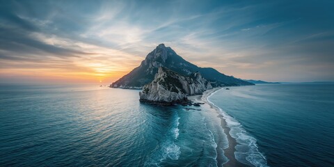 Cape at sunset against cloudy sky over rocky coast near Alcaq mountain, emphasizing scenic landscape