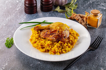 Roasted chicken leg with yellow rice