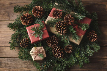 Pine cones with fir branches and Christmas gift boxes on wooden background, christmas, decoration, tree, holiday, xmas, gift, branch, celebration, ornament, winter, green, season, ball, fir, pine, pre