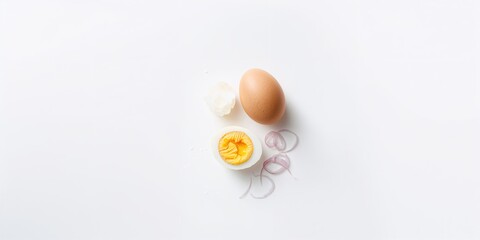 Fototapeta premium Peeled boiled egg with sliced half on a white background, suitable for food menu design, emphasizing natural and healthy ingredients