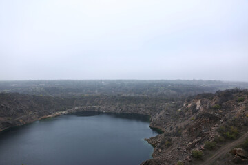 A large stone lake surrounded by rocky cliffs
