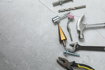 Repair tools, plumber, locksmith, electrician on concrete floor
