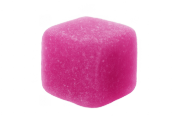 Pink gummy candy cube offering a sweet and chewy treat