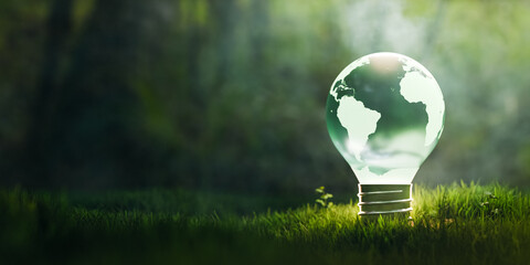 Sustainable earth globe light bulb on grass copy space.3d rendering