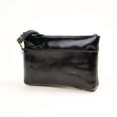 Naklejka premium Elegant black leather pouch isolated on white background