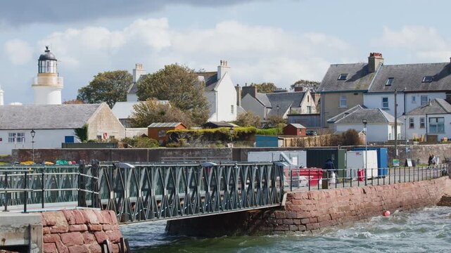 Coastal Bridge and Lighthouse in Cromarty Harbor Town, Scotland