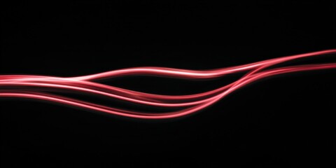 Abstract red light trails on black background
