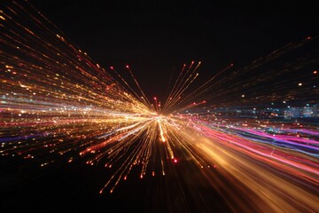 Vivid light trails radiating in vibrant night sky display